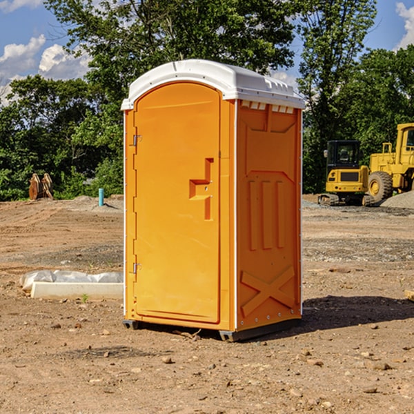 what is the cost difference between standard and deluxe portable restroom rentals in Des Lacs